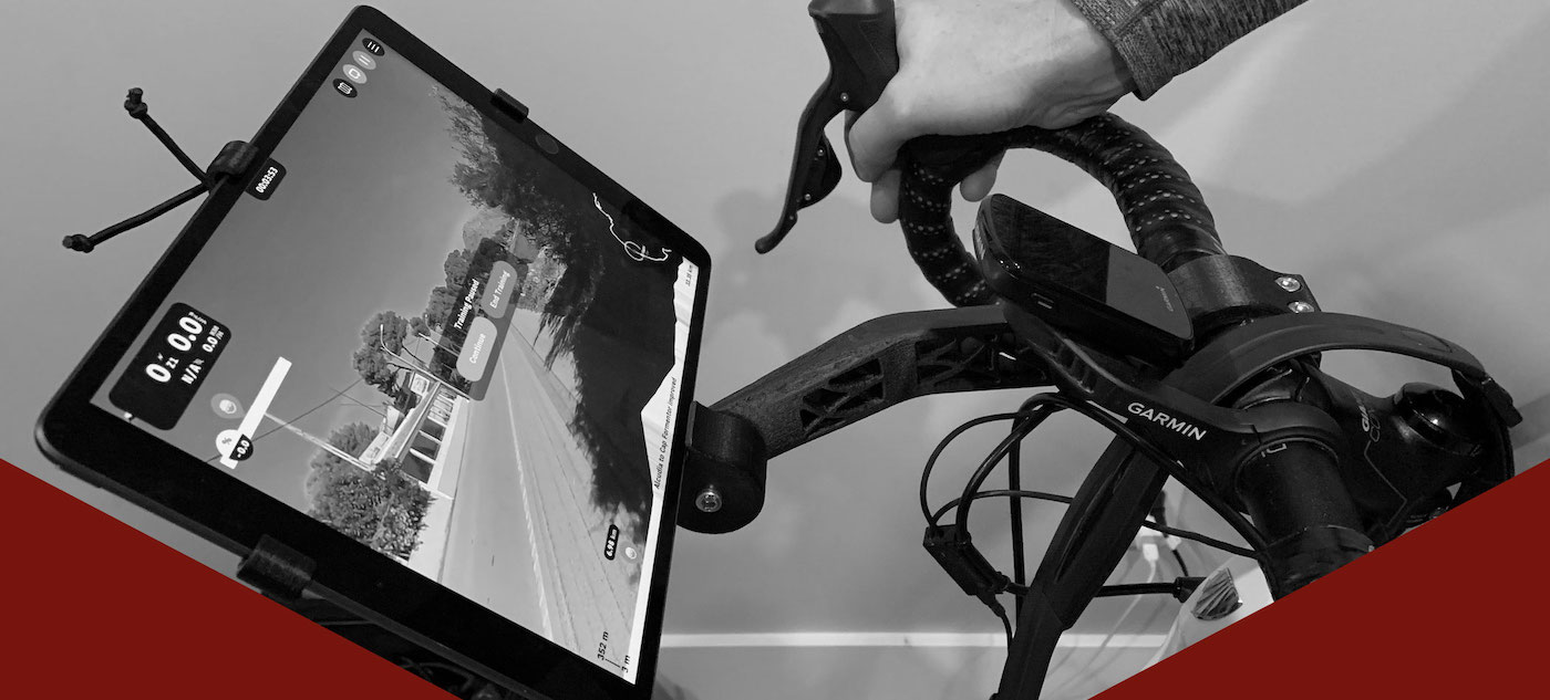 Stationary bike handlebar tablet stand